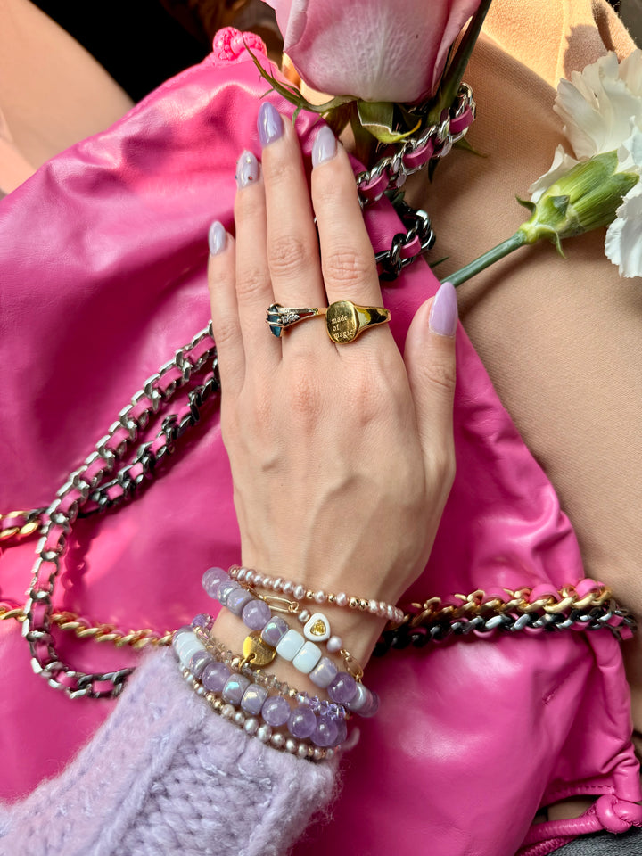Gold chain bracelet with white and gold heart bead 