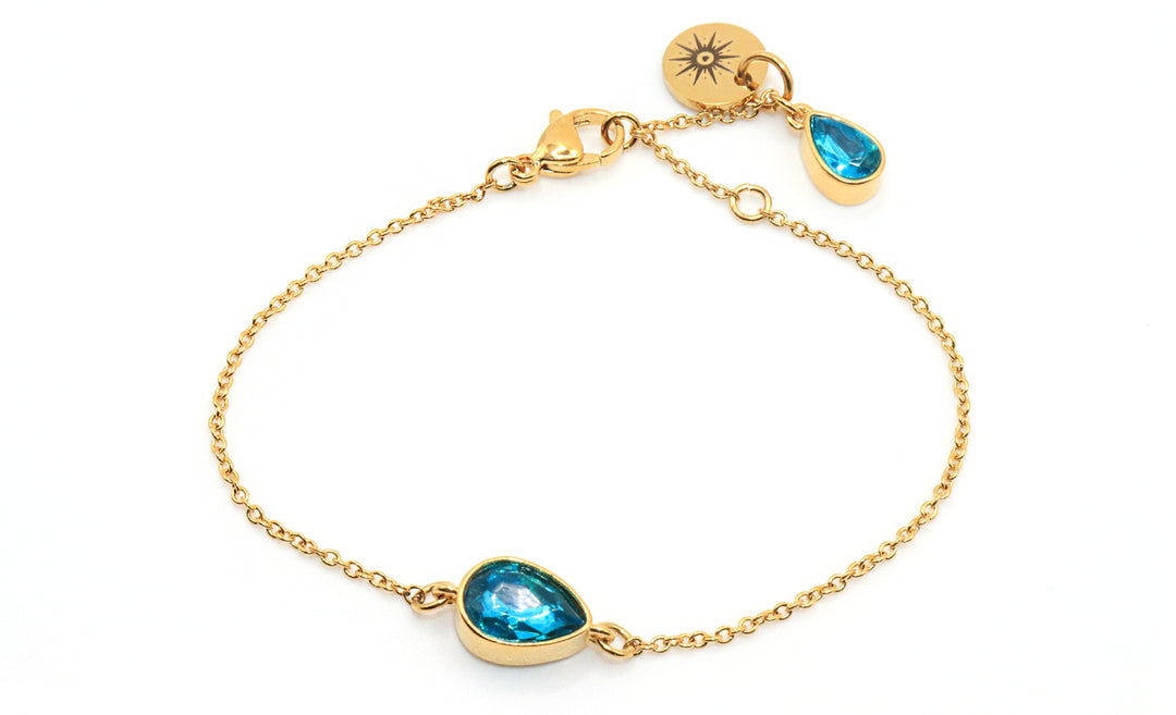 aqua blue gemstone on gold chain bracelet