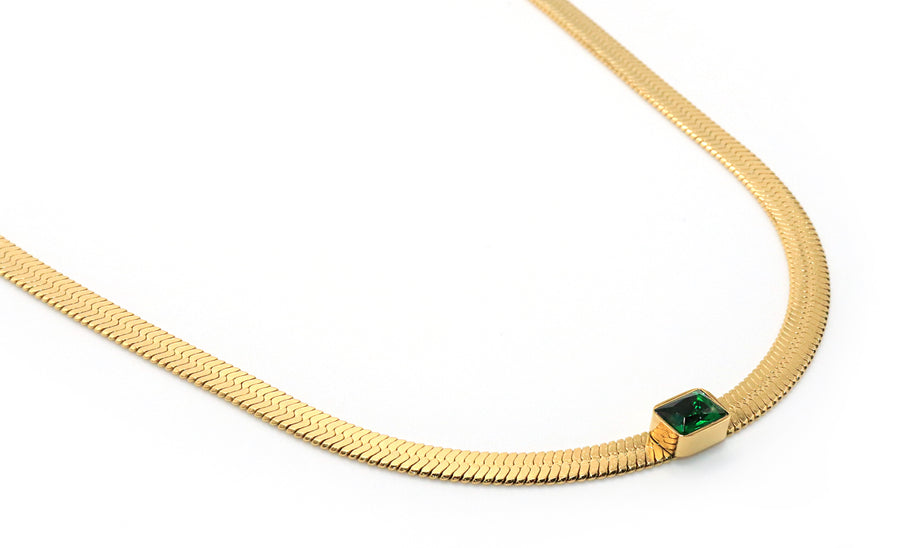 green gem necklace on stainless steel chain