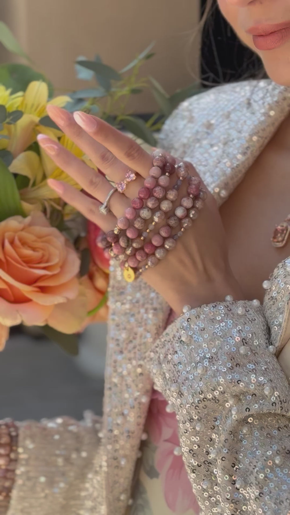 Pink gemstone bracelet with gold beads 
