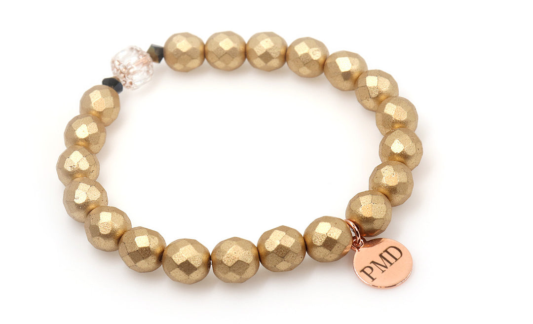 Satin gold beaded bracelet with rose gold charm for women